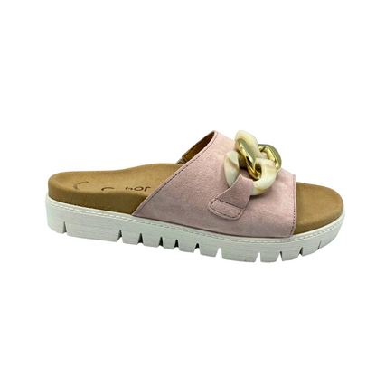 Outside view of a summer slide in a nude/soft pink tone with a chunky chain detail across the top