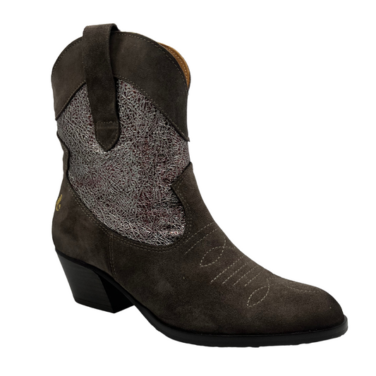 45 degree angled view of western style leather boot with pointed toe and short block heel.
