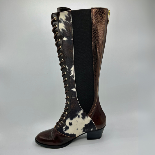 Knee-high boot with brown, black, and white pattern on a gray background