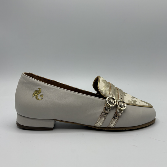 Right facing view of a beige loafer with buckle strap details