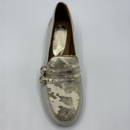 Top view of a beige loafer with buckle strap details