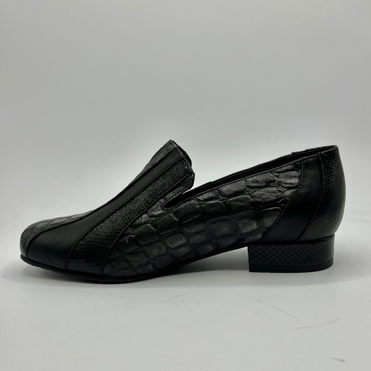 Black loafer shoe on a white background