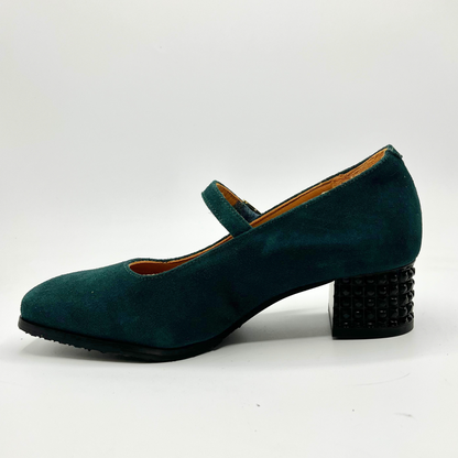 Left facing view of a deep green Maryjane heel shoe with a studded heel