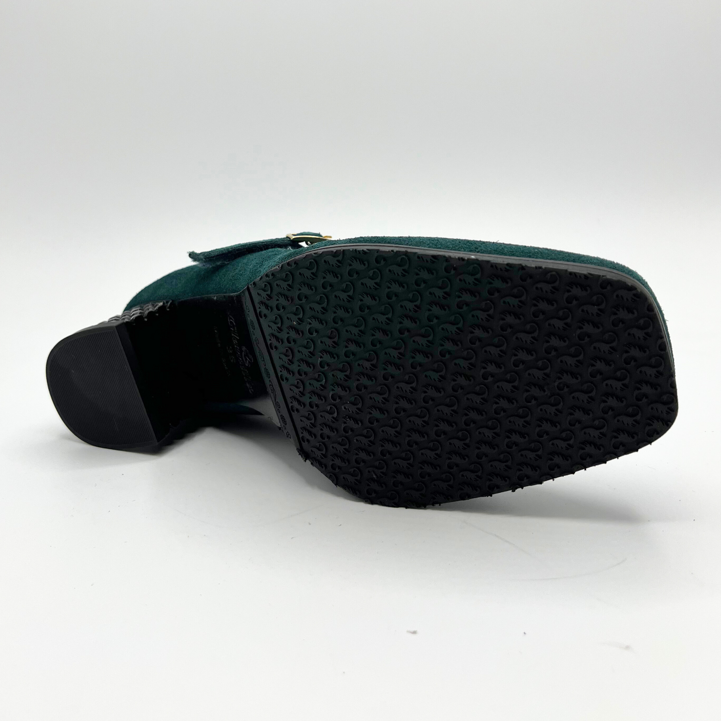 Bottom view of a deep green Maryjane heel shoe with a studded heel