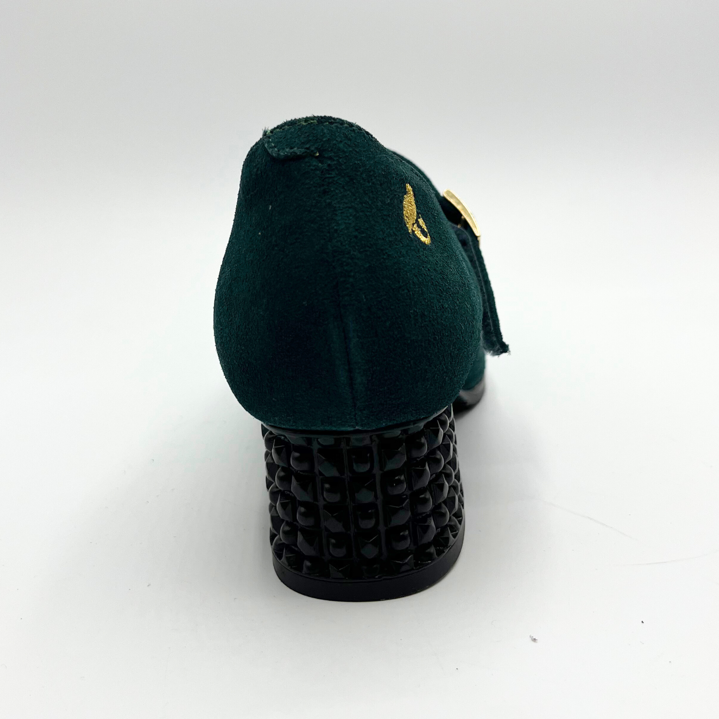 Back view of a deep green Maryjane heel shoe with a studded heel