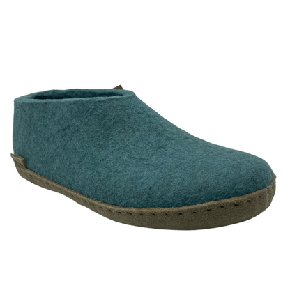 45 degree angled view of blue felted wool shoe with leather sole
