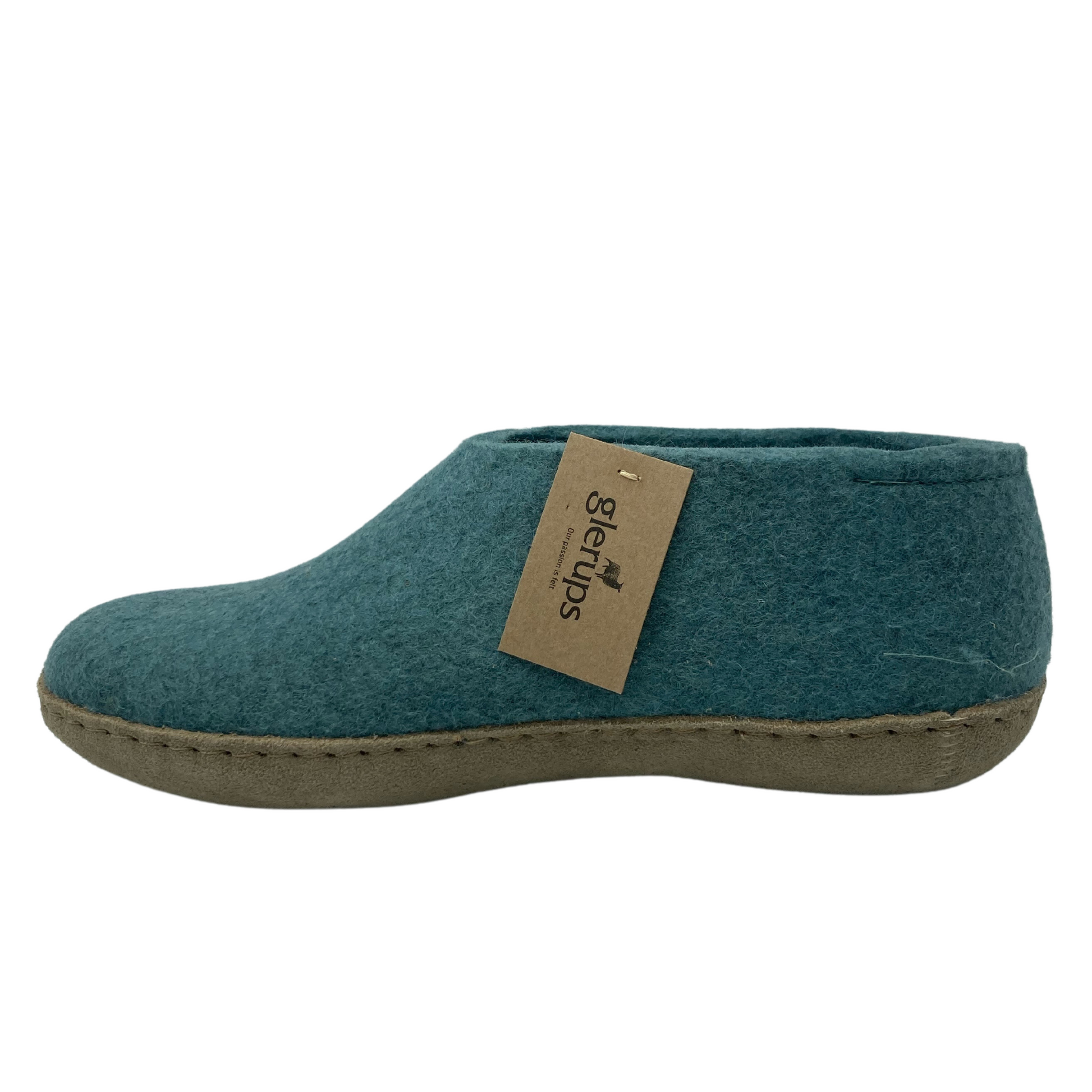 Left facing view of felted wool shoe with suede leather sole