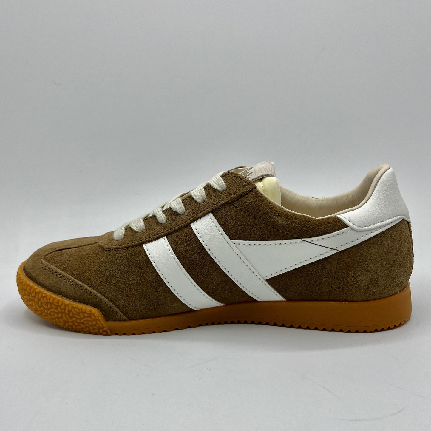 Brown and white sneaker with a plain background