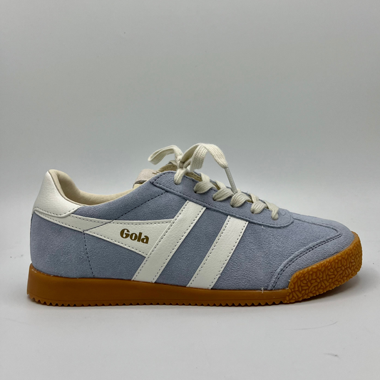 Right facing view of a blue suede sneaker with white accents, a gum outsole and a lace up design.