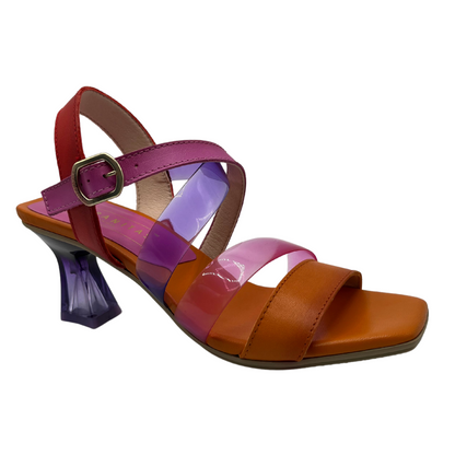 45 degree angled view of orange, pink, and cherry coloured sandal with flared heel and squared toe