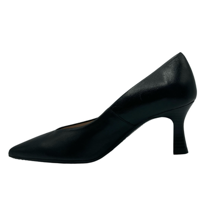 Left facing view of black leather pump with flared heel and pointed toe