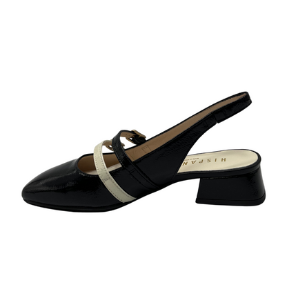 Left facing view of black patent leather mary jane with a natural coloured accent strap. Sling back strap, wrapped block heel and square toe