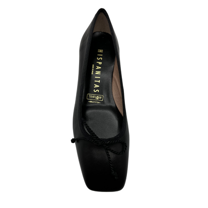 Top view of black ballet style pump with short block heel. Bow detail on upper and features a square toe