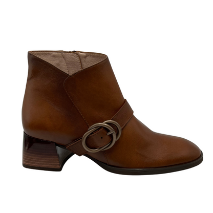 Right facing view of tan leather short boots with a block heel, side zipper closure and rounded toe