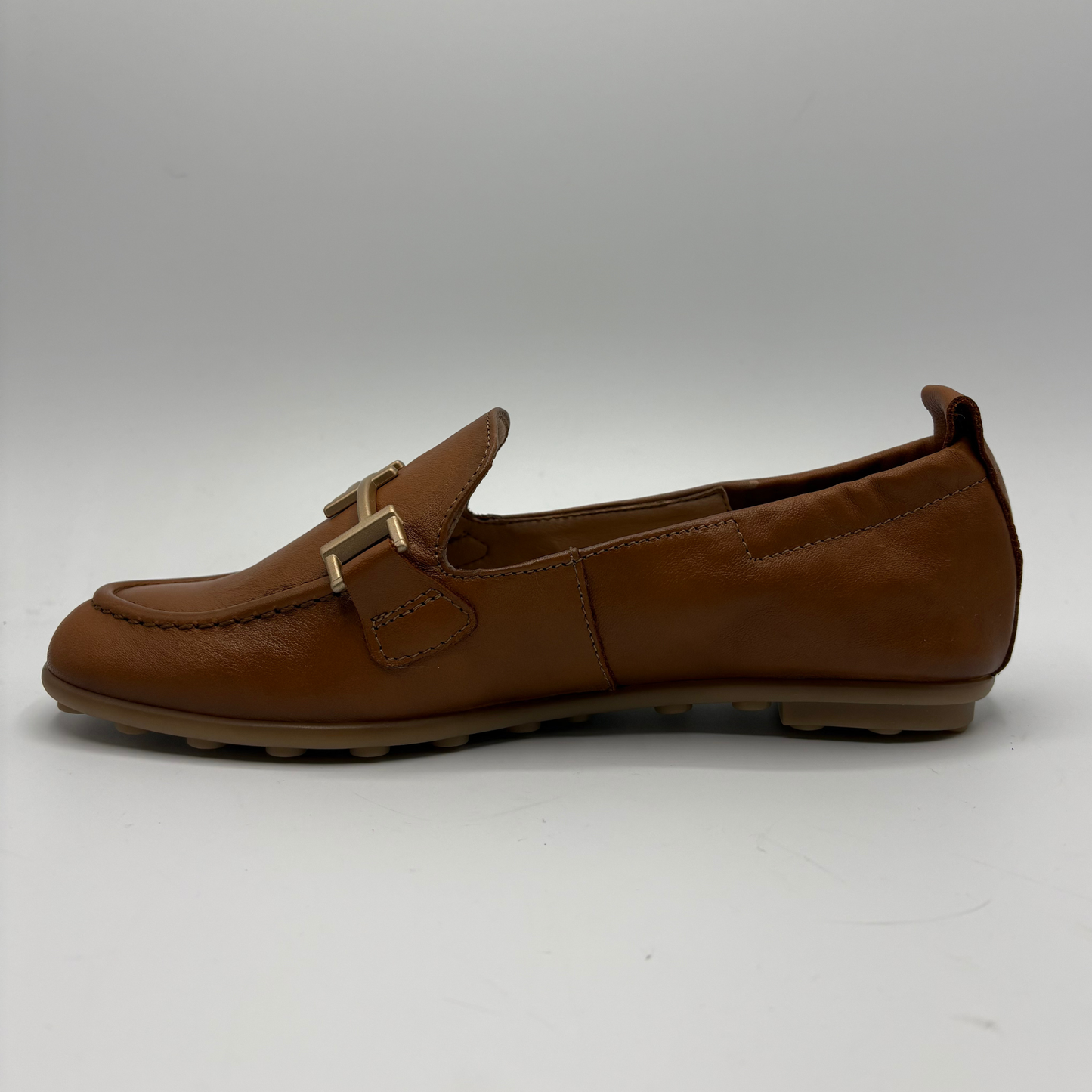 Brown loafer shoe on a white background
