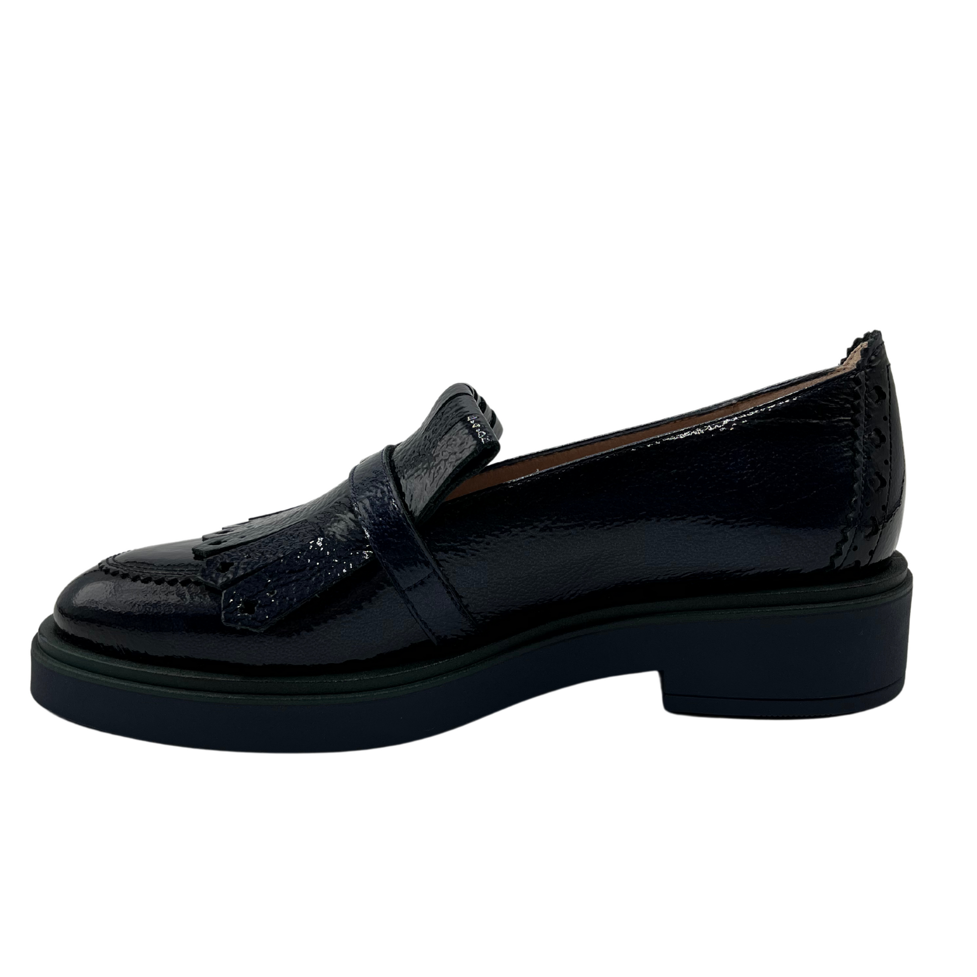 Left facing view of midnight blue leather loafer with low heel and adjustable buckle on upper.