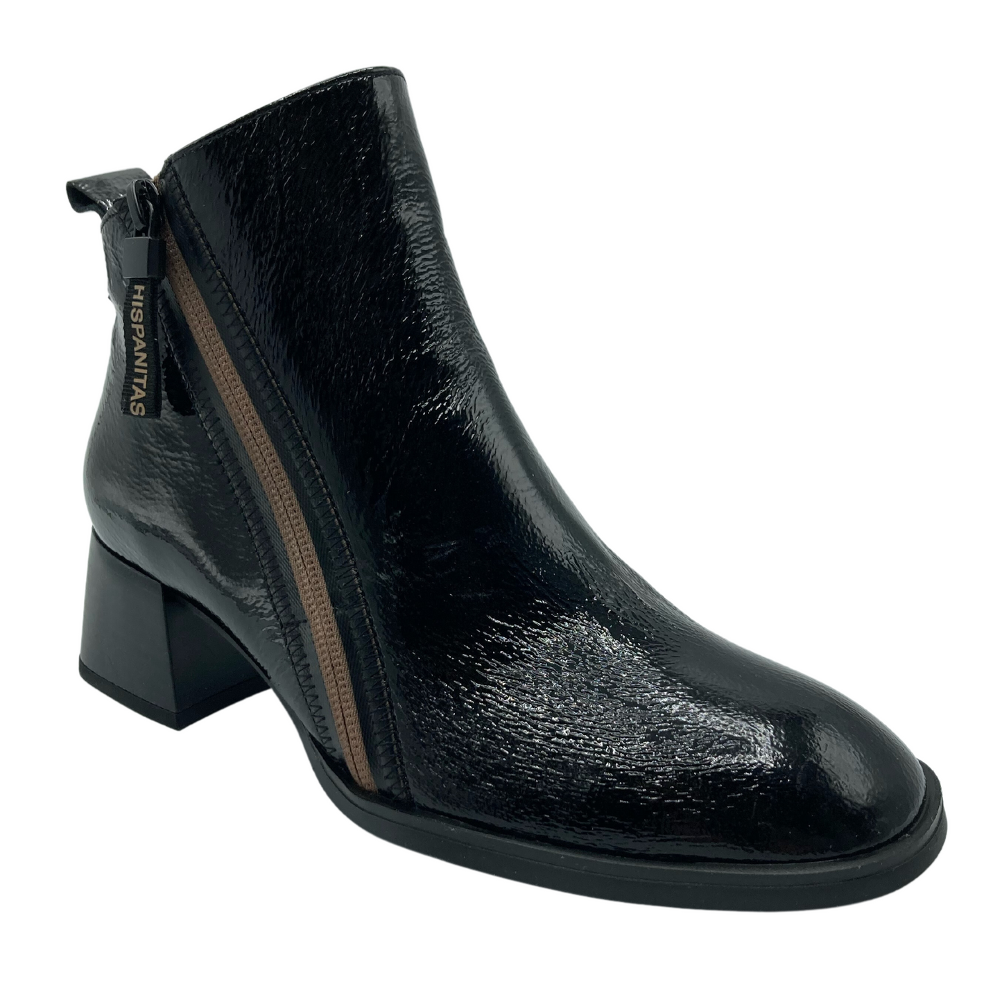 Angled view of black patent leather boot with rounded toe and logo zipper pull