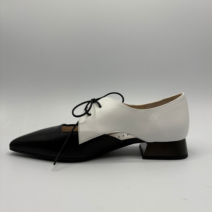 Black and white shoe on a gray background