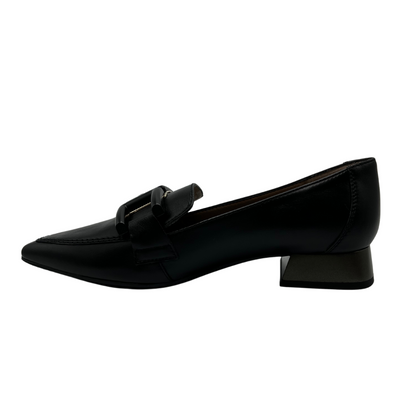 Left facing view of black leather loafer with pointed toe, buckle detail and block heel