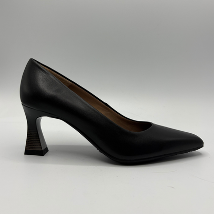 A single black leather high-heeled pump with a pointed toe and a sculptural curved block heel, shown in profile against a neutral gray background.