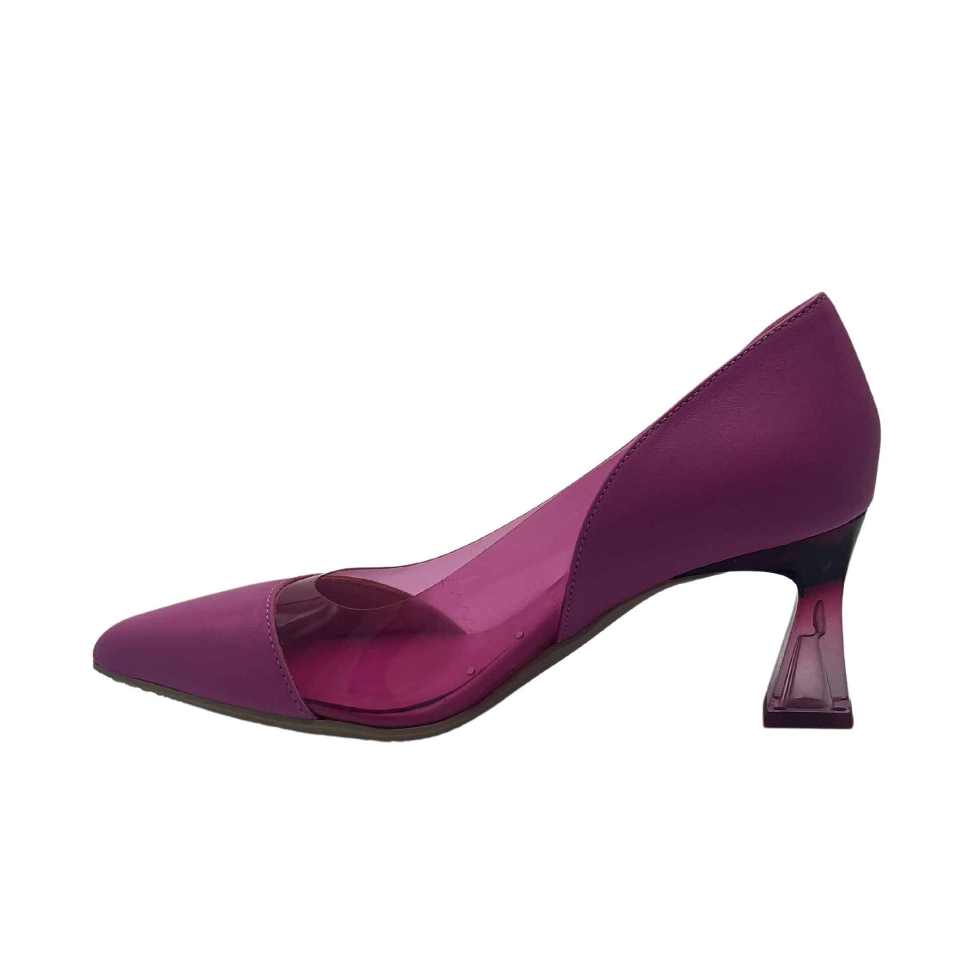 Left facing view of pink pointed toe pump with flared lucite heel
