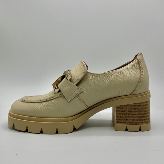 Beige loafer shoe with a chunky sole on a gray background