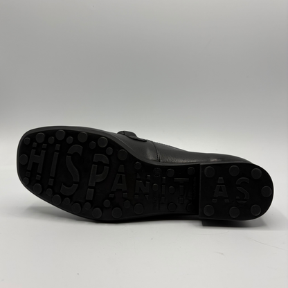 Close-up of a black shoe sole on a white background