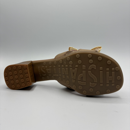 Brown sandal sole with 'Hispanitas' branding on a gray background