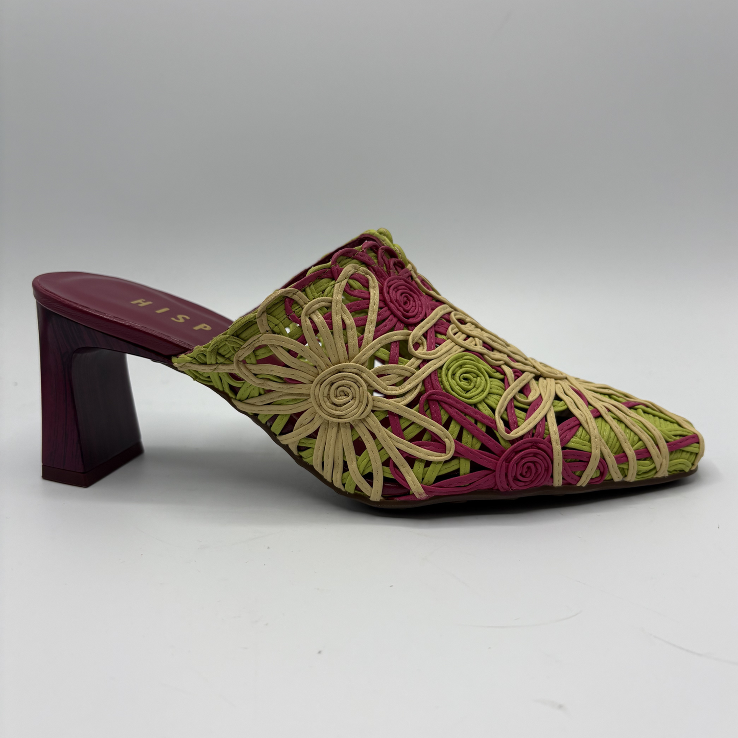 Embroidered shoe with floral patterns on a gray background