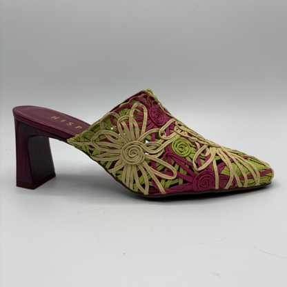 Embroidered shoe with floral patterns on a gray background