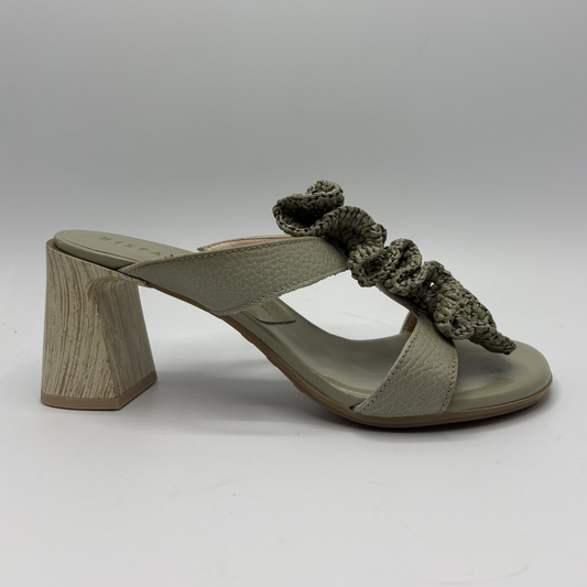 Green sandal with wooden heel on a white background
