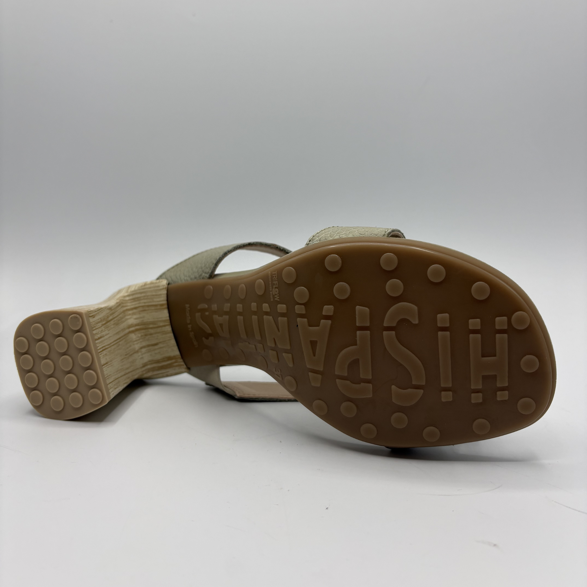 Close-up of a sandal sole with 'HISPANITAS' branding on a white background