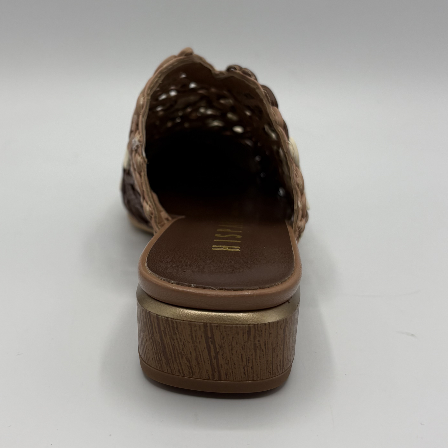 Brown woven sandal with wooden sole on a white background