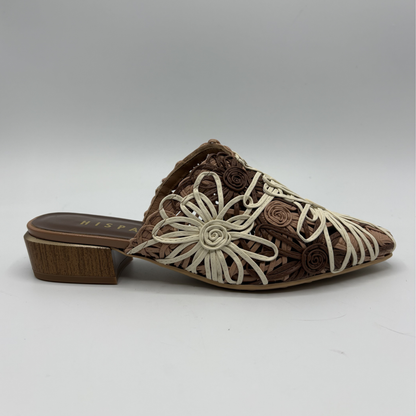 Brown shoe with floral design on a white background