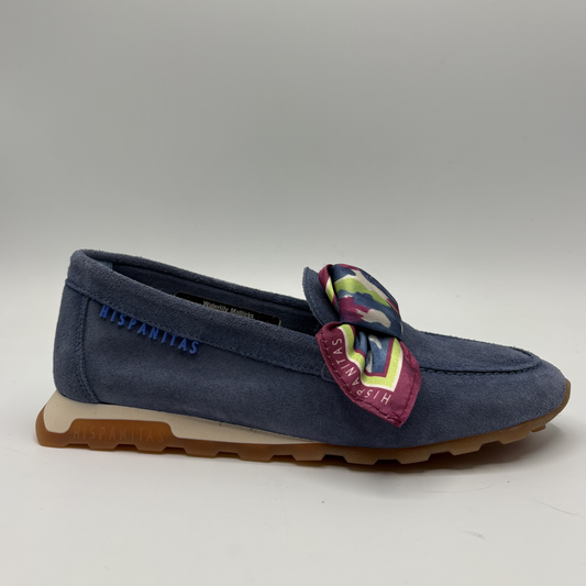 Right facing view of a blue suede loafer with a scarf accent