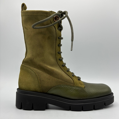Right facing view of an army green lace up boot with a black rubber outsole