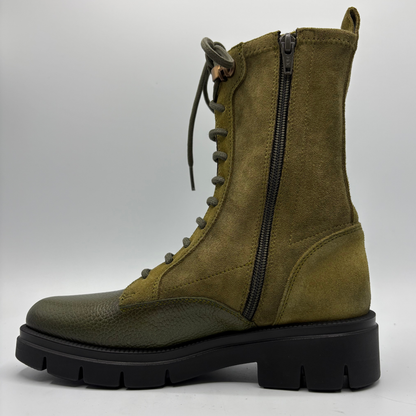 Left facing view of an army green lace up boot with a black rubber outsole