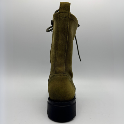 Back view of an army green lace up boot with a black rubber outsole