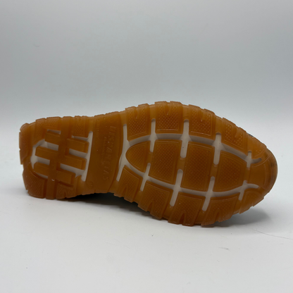 Brown sole of a shoe on a white background
