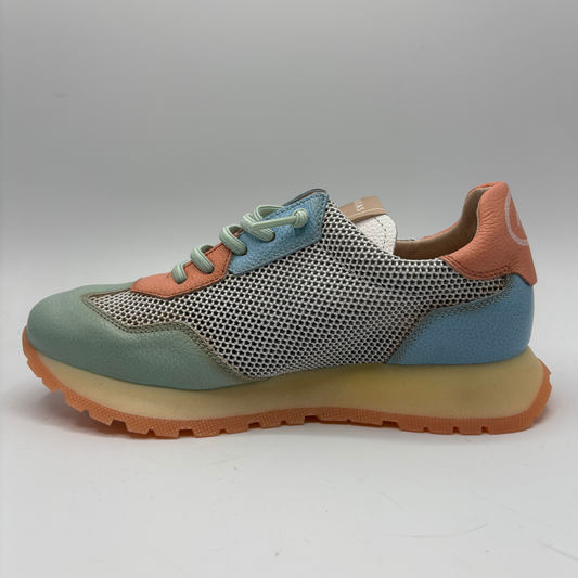 Multicolored sneaker with a textured sole on a gray background