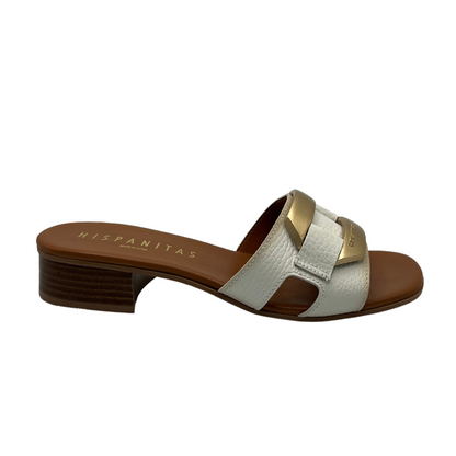 Right facing view of white and brown leather mule sandal with 3cm heel and gold brooch detail on upper
