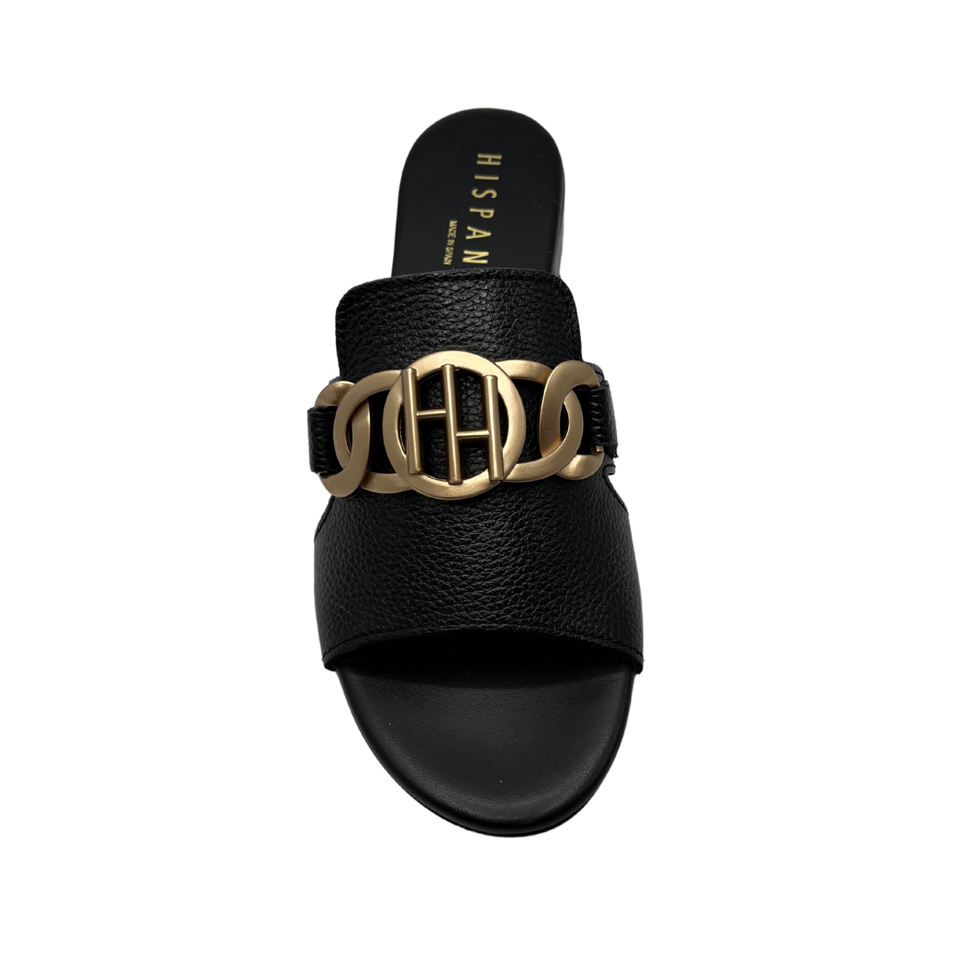 Top view of black leather slip on sandal with a low block heel and gold detail on upper.