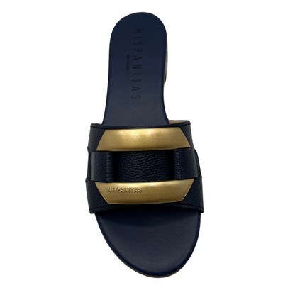 Top view of slip on sandal with a navy coloured leather strap. Leather lined, short block heel and gold detail on upper.