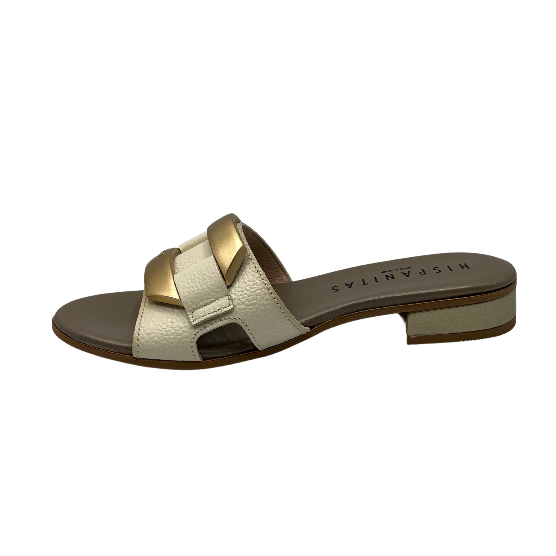 Left facing view of slip on sandal with a cream coloured leather strap. Leather lined, short block heel and gold detail on upper.