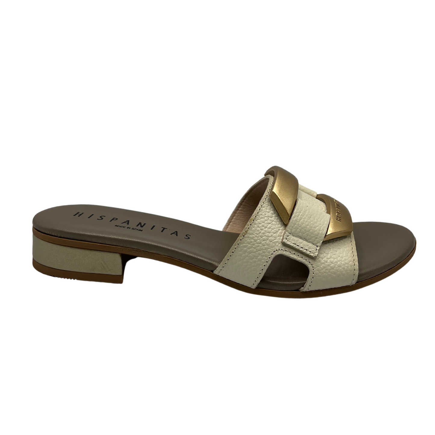 Right facing view of slip on sandal with a cream coloured leather strap. Leather lined, short block heel and gold detail on upper.