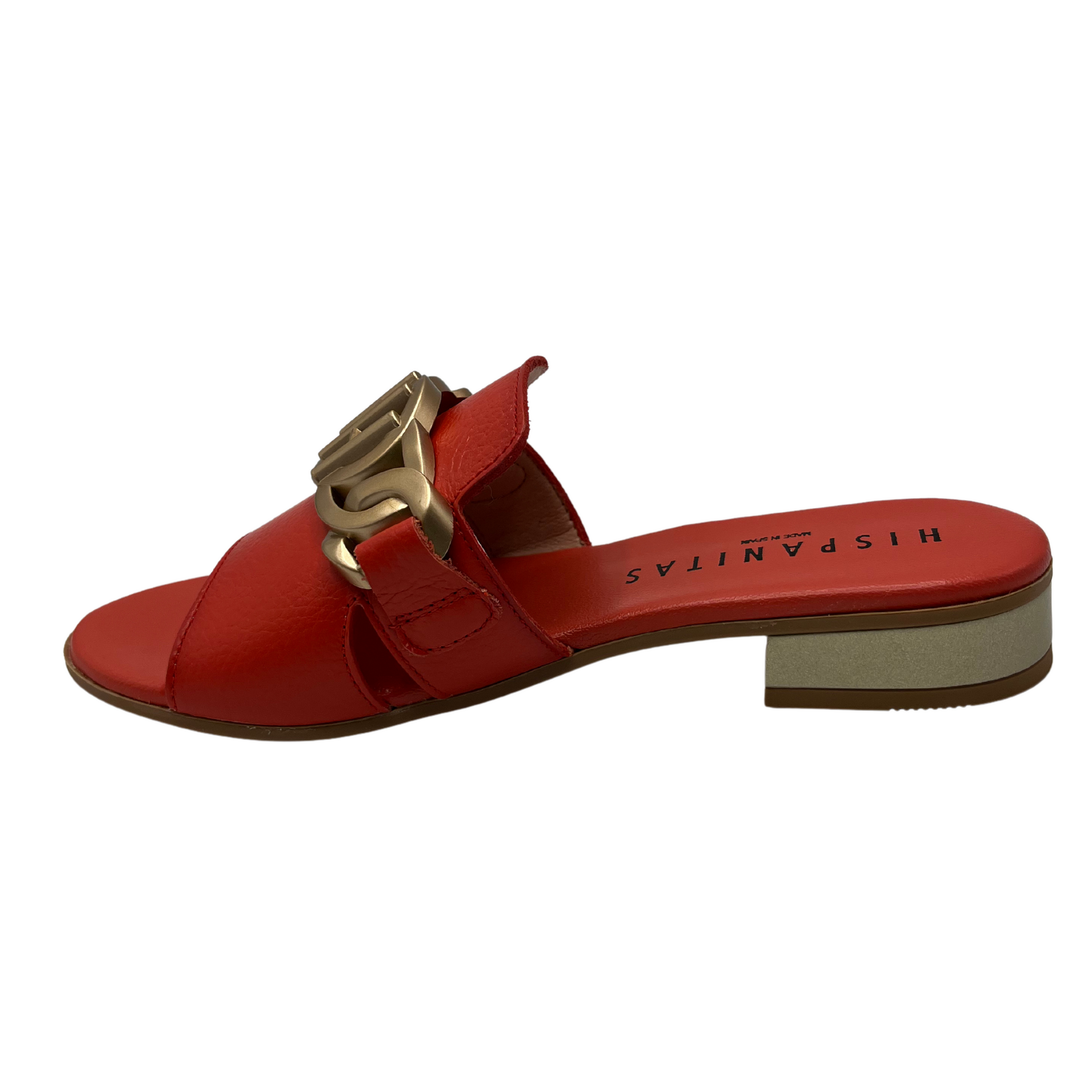 Left facing view of scarlet leather slip on sandal with a low block heel and gold detail on upper.