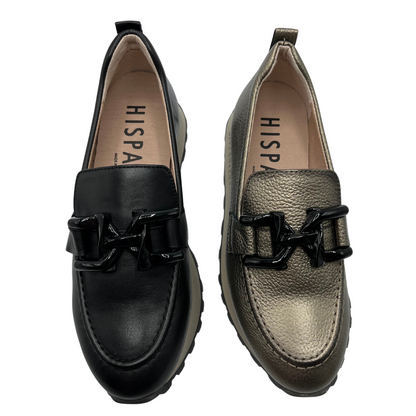 Top view of a pair of leather loafers beside each other. One is black and one is basalt. Both are leather lined, thick soled with a black detail on upper