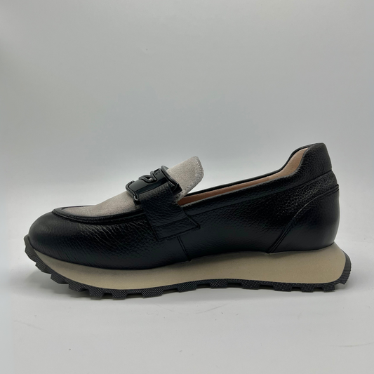 Black loafer shoe on a white background