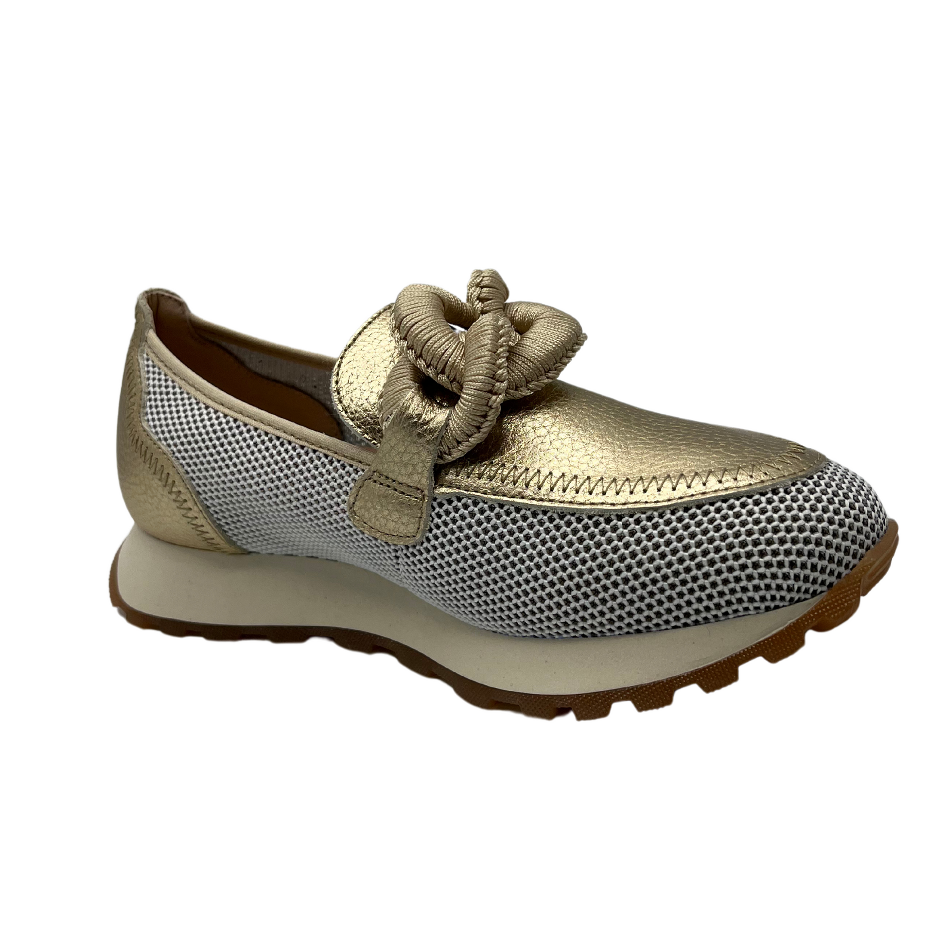 Angled view of gold leather loafer with mesh sides, thick outsole and chain detail on upper.