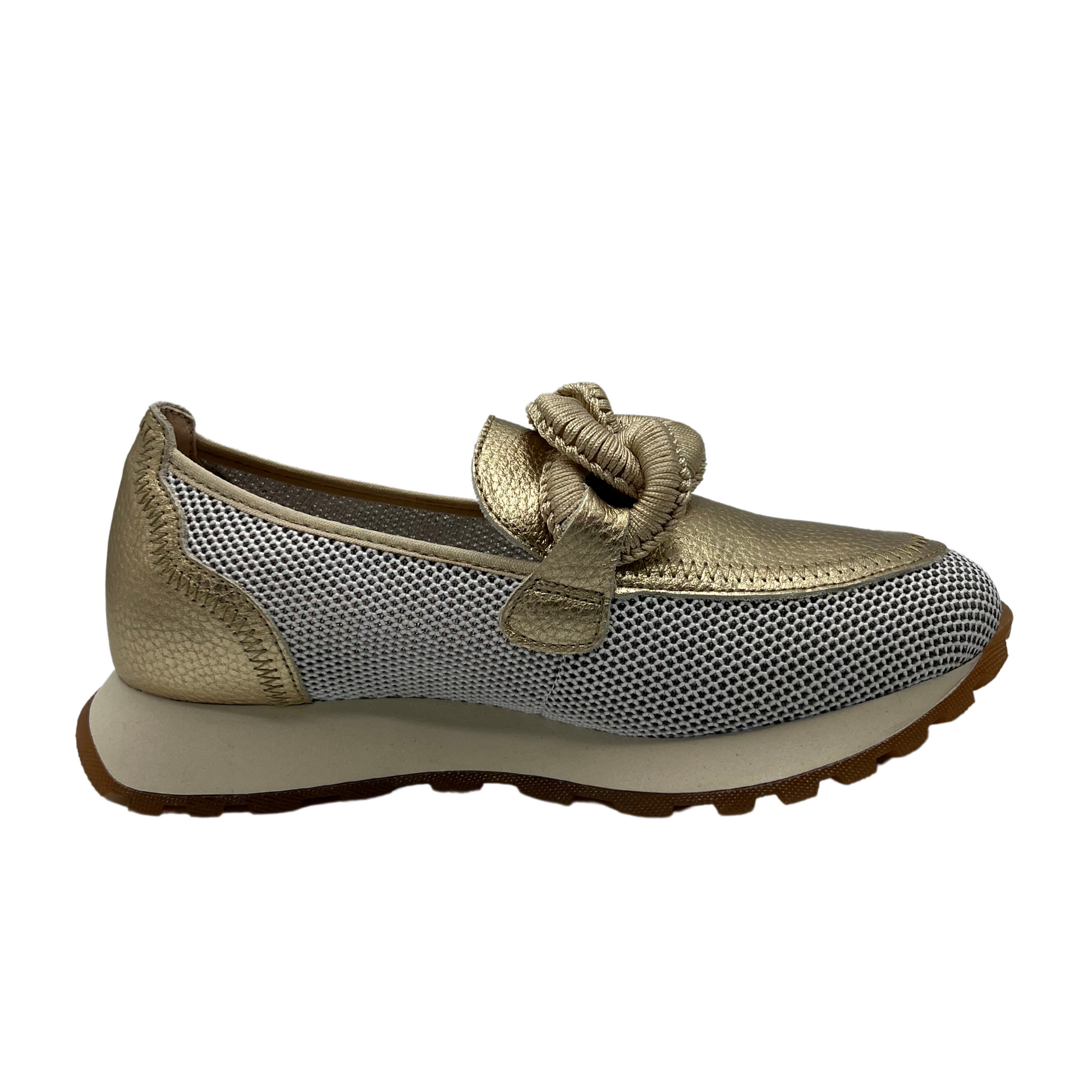 Right facing view of gold leather loafer with mesh sides, thick outsole and chain detail on upper.